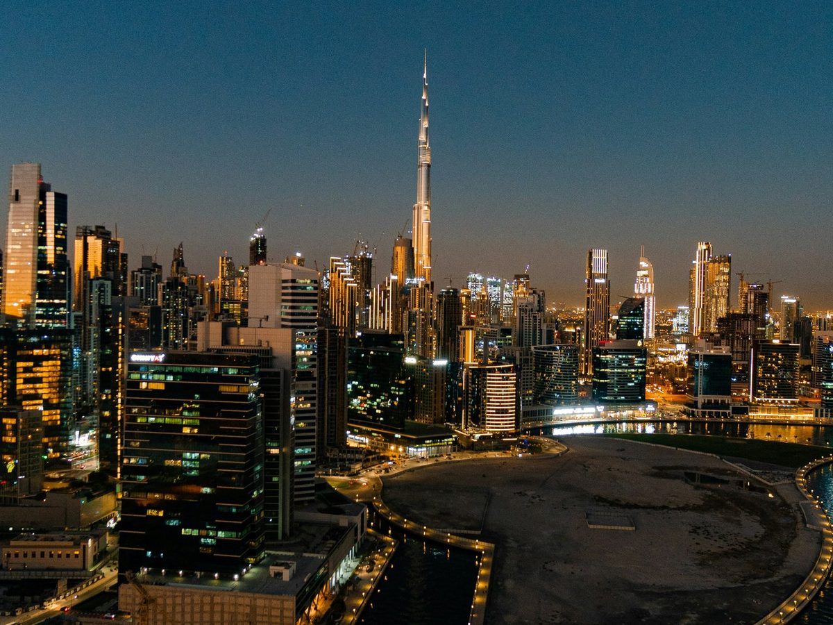 Dubai skyline and the Burj Khalifa at dusk, seen from Business Bay